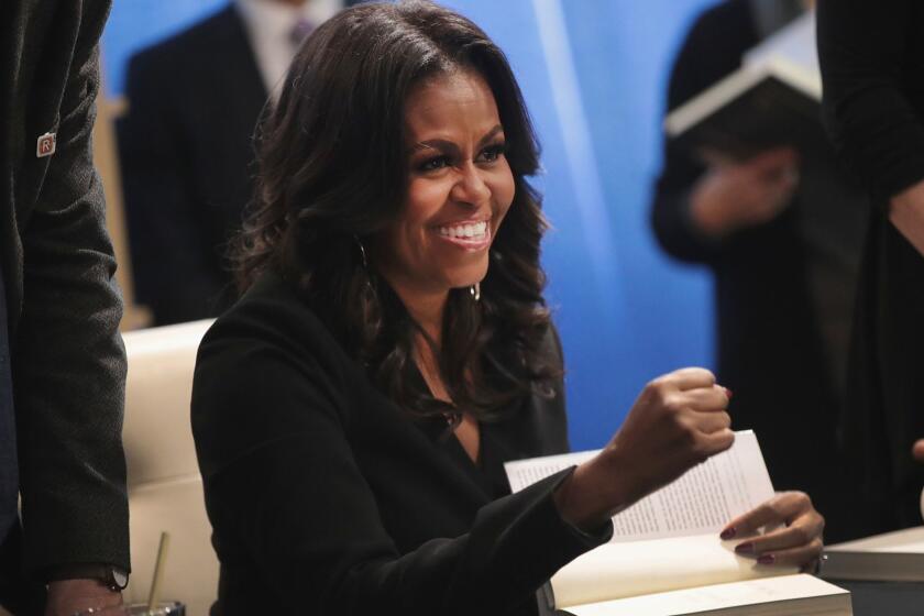 CHICAGO, IL - NOVEMBER 13: Former first lady Michelle Obama kicks off her ?Becoming? book tour with a signing at the Seminary Co-op bookstore on November 13, 2018 in Chicago, Illinois. In the book, which was released today, Obama describes her journey from Chicago's South Side to the White House. (Photo by Scott Olson/Getty Images) ** OUTS - ELSENT, FPG, CM - OUTS * NM, PH, VA if sourced by CT, LA or MoD **