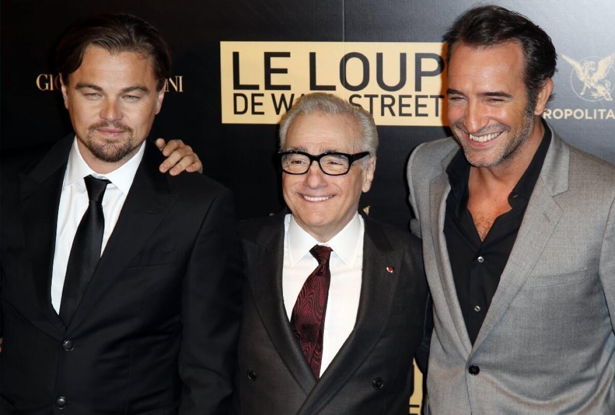 Actor Leonardo DiCaprio, left, and director Martin Scorsese, center, shown with "Wolf of Wall Street" co-star Jean Dujardin, will receive an honor at the Santa Barbara International Film Festival.