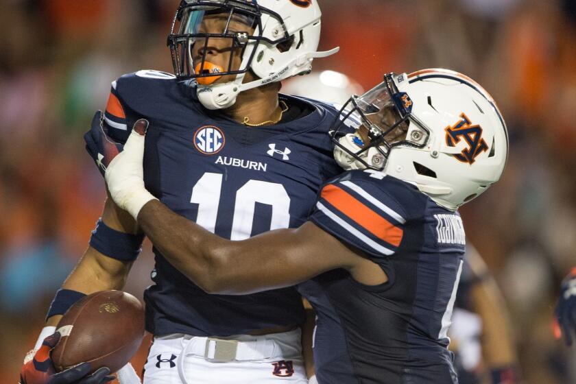 AUBURN, AL - SEPTEMBER 8: Running back Devan Barrett #10 of the Auburn Tigers celebrates with wide receiver Noah Igbinoghene #4 of the Auburn Tigers after scoring a touchdown during their game against the Alabama State Hornets in the second quarter at Jordan-Hare Stadium on September 8, 2018 in Auburn, Alabama. (Photo by Michael Chang/Getty Images) ** OUTS - ELSENT, FPG, CM - OUTS * NM, PH, VA if sourced by CT, LA or MoD **