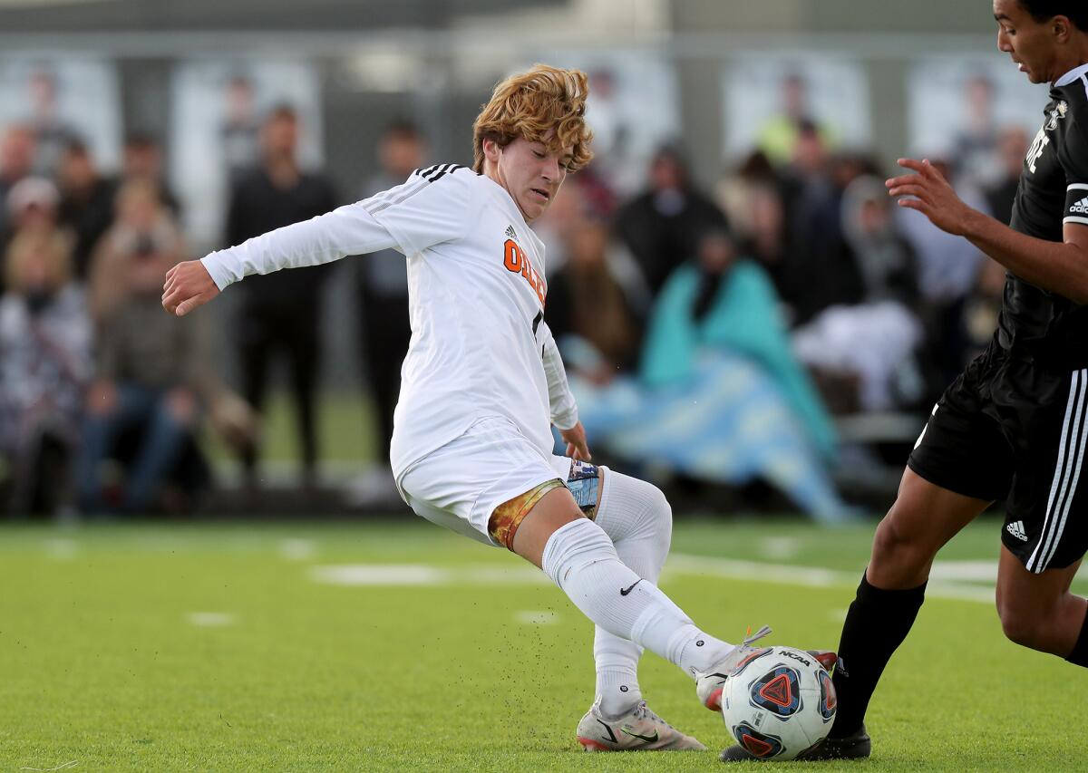 Huntington Beach's Nico Ruiz , left, competes against Servite in a CIF Southern Section Division 1 semifinal on Tuesday.