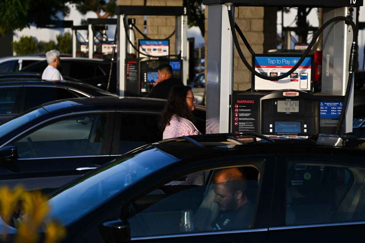 Drivers pump gasoline into vehicles.