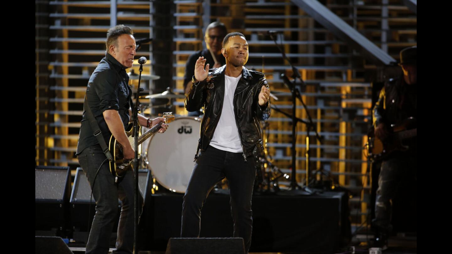 Bruce Springsteen and John Legend perform "American Skin (41 Shots)" at the taping of an A&E special at the Shrine Auditorium.