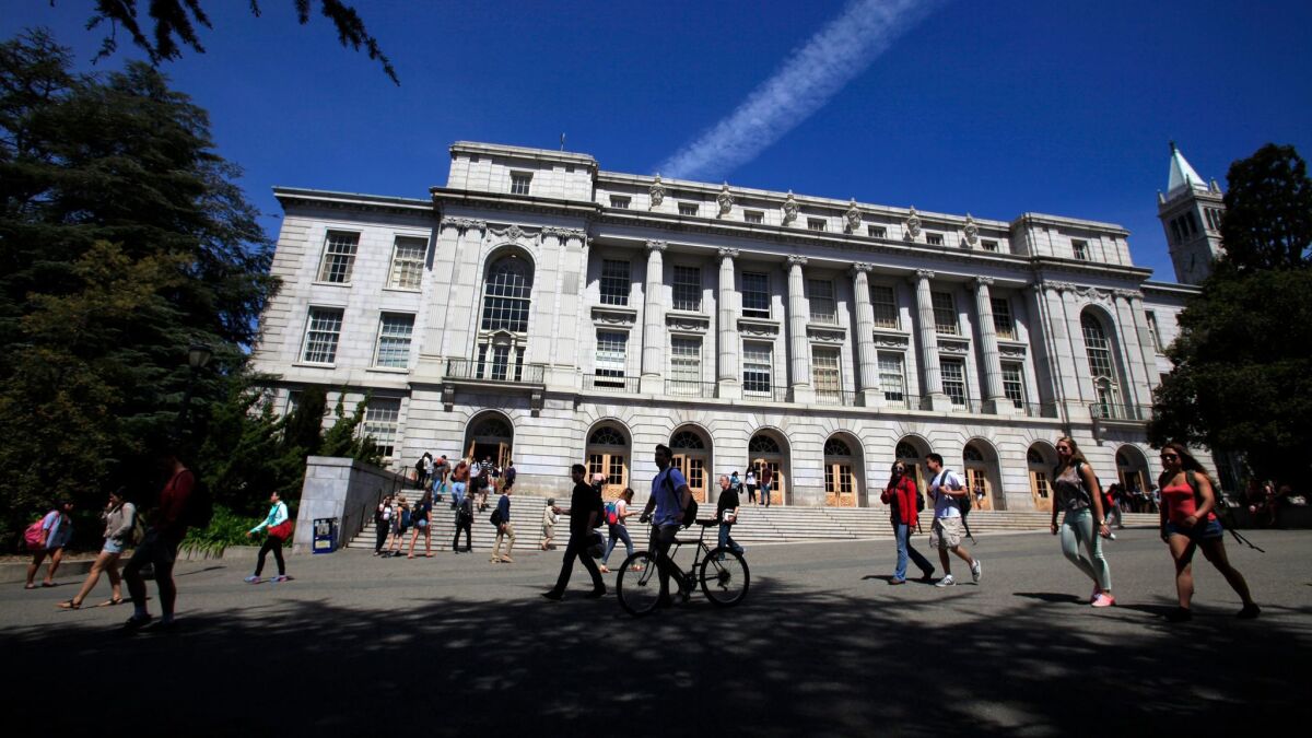 Students stroll past Wheeler Hall at UC Berkeley.
