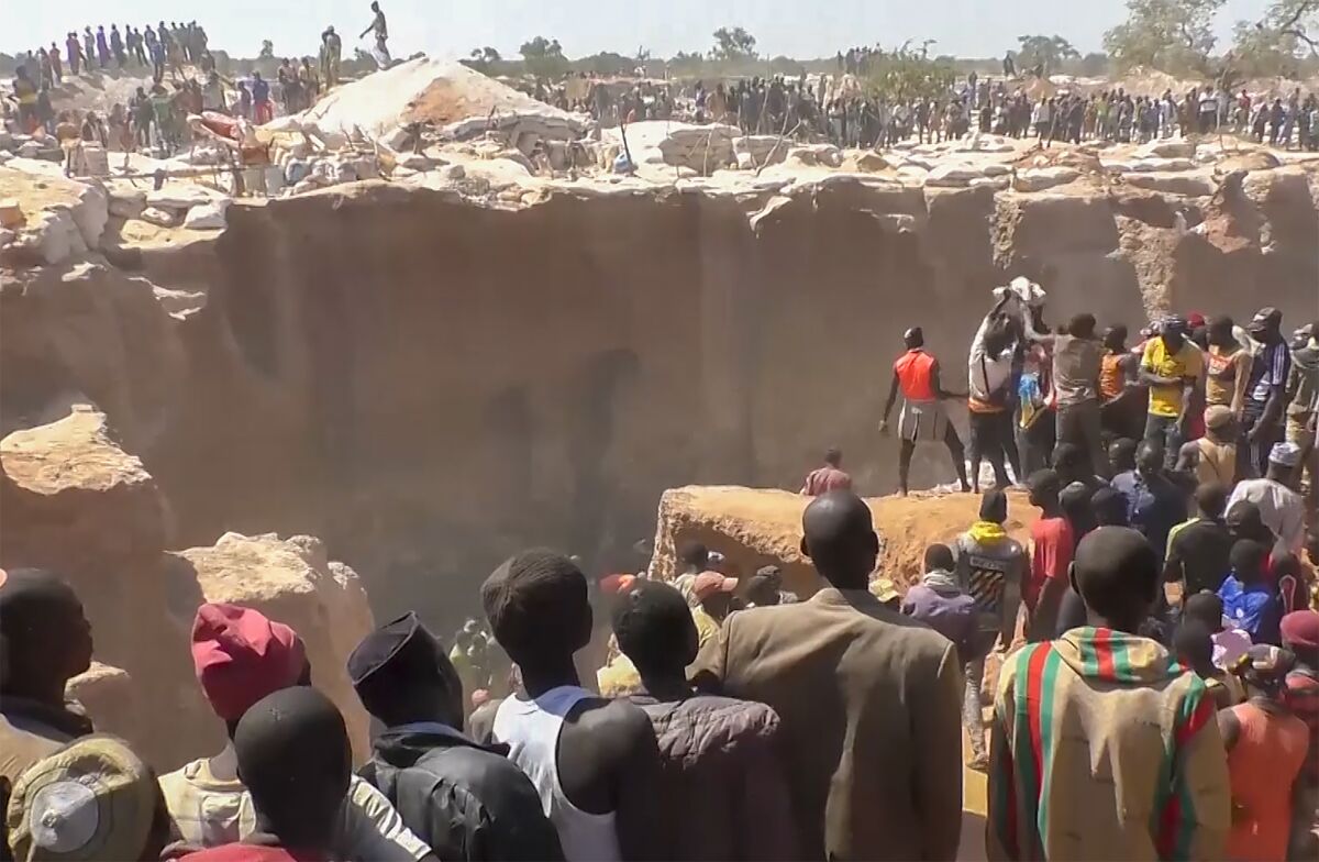 This image from video shows the scene of a gold mine collapse in the Maradi region village of Dan Issa, Niger, near the border with Nigeria Sunday Nov. 7, 2021. At least 18 people were killed and 7 were injured in the collapse.(AP Photo)
