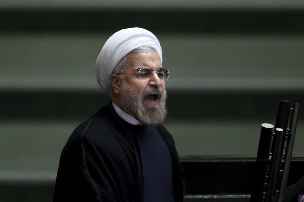 In Tehran, Iranian President Hassan Rouhani speaks during the parliamentary debate on his proposed Cabinet members.