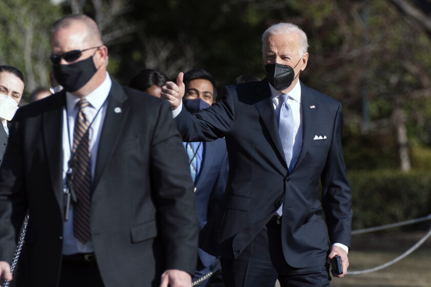 President Joe Biden gives a thumbs up as he walks to board Marine One on the South Lawn of the White House, Friday, Feb. 11, 2022, in Washington to travel to Camp David, Md. (AP Photo/Manuel Balce Ceneta)