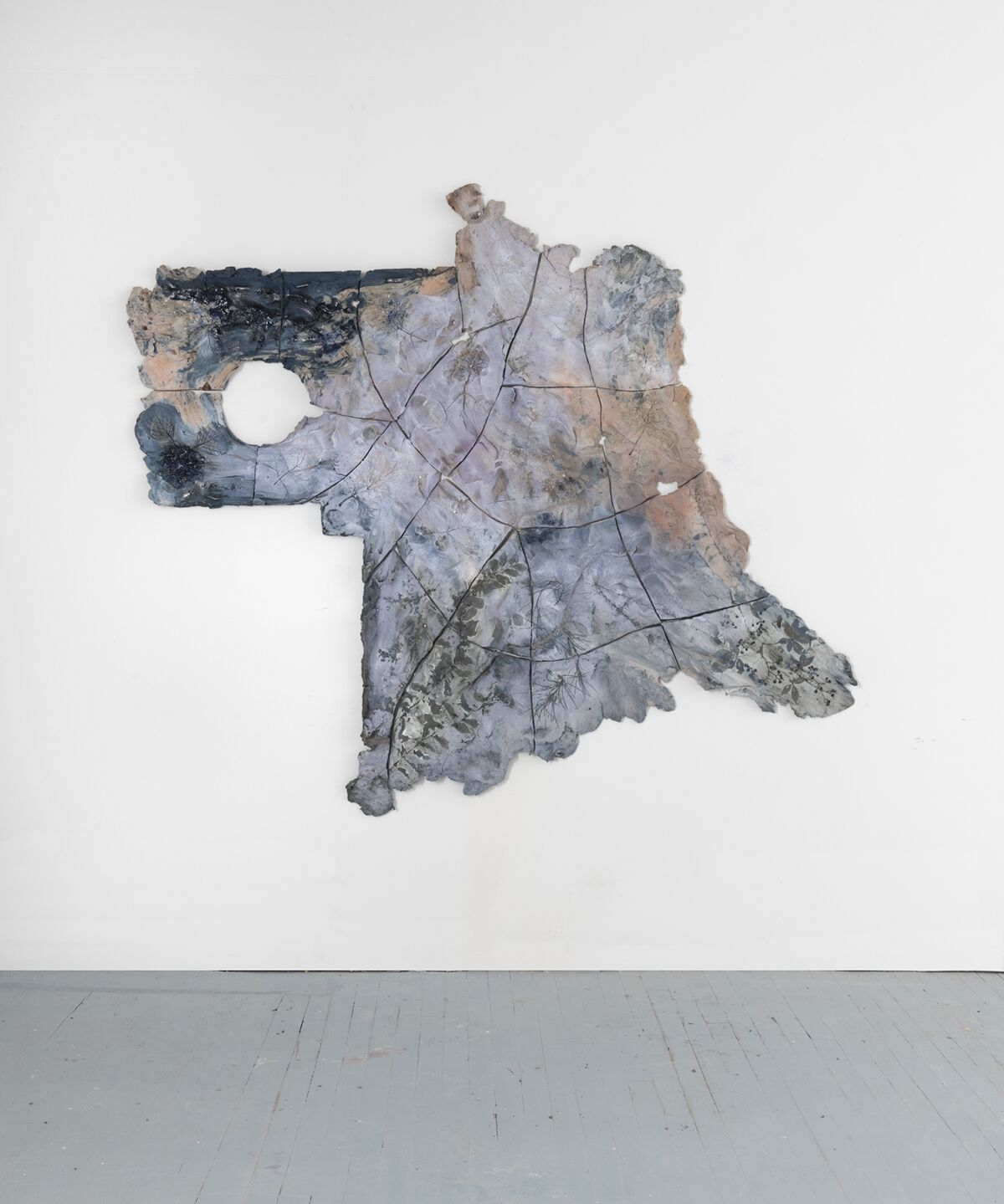 Brie Ruais' "Topology of a Garden, Southwest, 127.5 lbs.," 2018. Pigmented clay, underglaze, and hardware, 68 inches by 78 inches by 2.5 inches.