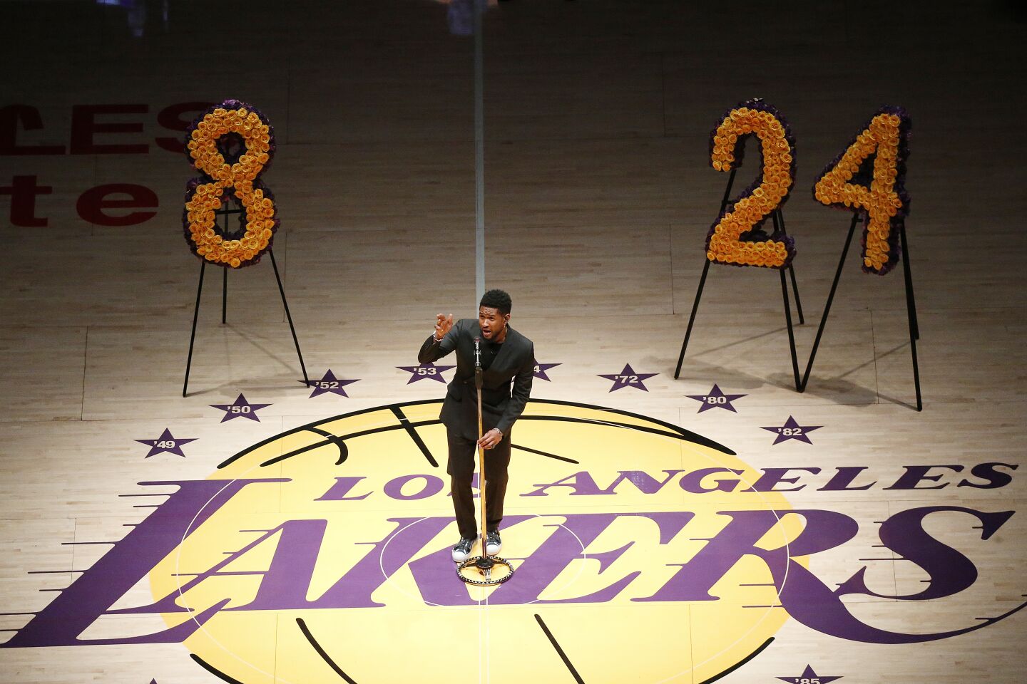 Usher sings "Amazing Grace" during a tribute to Kobe Bryant and the eight others killed in a helicopter crash before a game between the Lakers and Portland Trail Blazers at Staples Center on Jan. 31, 2020.