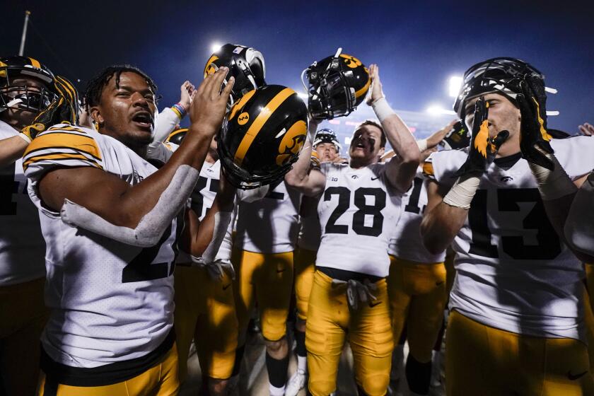 Iowa players celebrate after defeating Maryland 51-14 on Oct. 1, 2021, in College Park, Md.