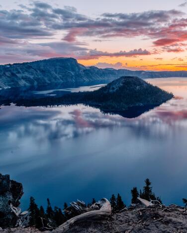 Clouds reflect in the water at Crater Lake.
