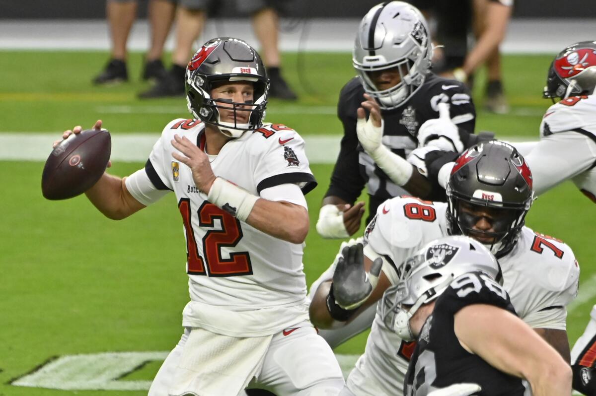 Tampa Bay Buccaneers quarterback Tom Brady looks to throw against the Las Vegas Raiders.