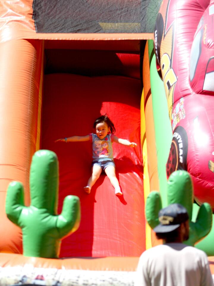 Beth Kim, 4 of Montrose, enjoyed the slides at the annual Hometown Country Fair, at Crescenta Valley Park in La Crescenta on Saturday, April 16, 2016. Carnival rides, a car show, arts & crafts exhibits along with live entertainment were just some of the attractions attendees enjoyed.