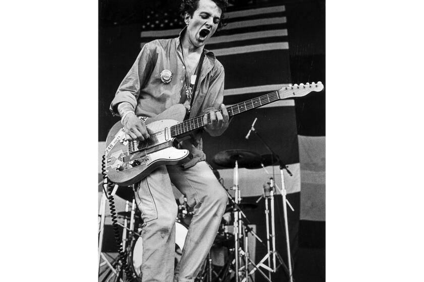 Sep. 9, 1979. Joe Strummer of The Clash appearing at the music festival at the Monterey Fairgrounds. Strummer, frontman of the British punk band The Clash, who has died at the age of 50, his official website said Monday, Dec. 23, 2002. Strummer, born John Graham Mellor, helped make aggressive punk music a worldwide phenomenon with hits like "Should I Stay or Should I go" and "London Calling." Times photo by George Rose.