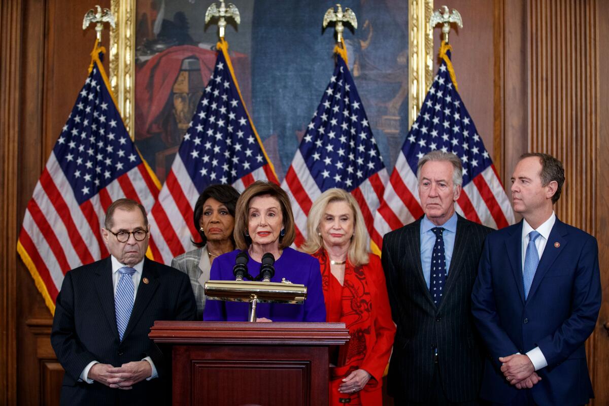 Speaker of the House Nancy Pelosi (D-San Francisco) and other members of Congress unveil articles of impeachment against President Trump on Tuesday.