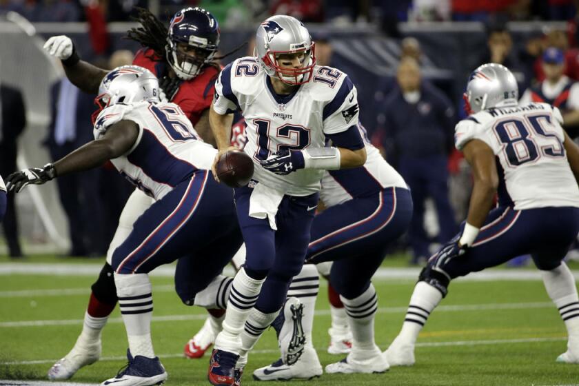 New England Patriots quarterback Tom Brady (12) drops back from the line of scrimmage during the first half against the Houston Texans on Dec. 13.