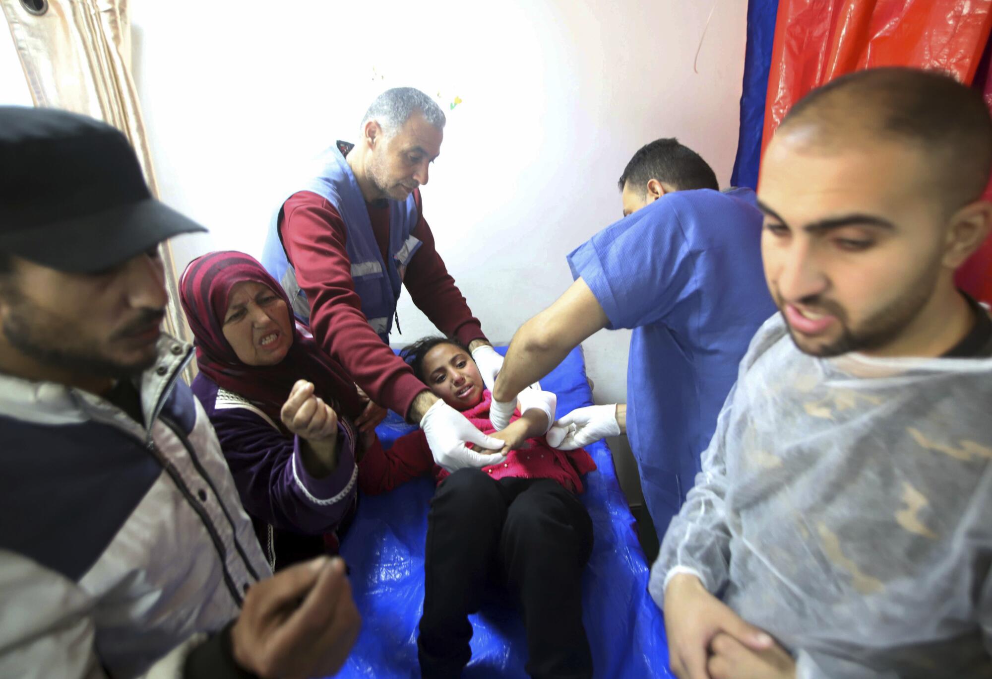 Medics treating wounded girl in Gaza