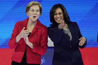 Democratic presidential candidate Sen. Elizabeth Warren, D-Mass., left and Democratic presidential candidate Sen. Kamala Harris, D-Calif. react to the audience Thursday, Sept. 12, 2019, before a Democratic presidential primary debate hosted by ABC at Texas Southern University in Houston. (AP Photo/David J. Phillip)