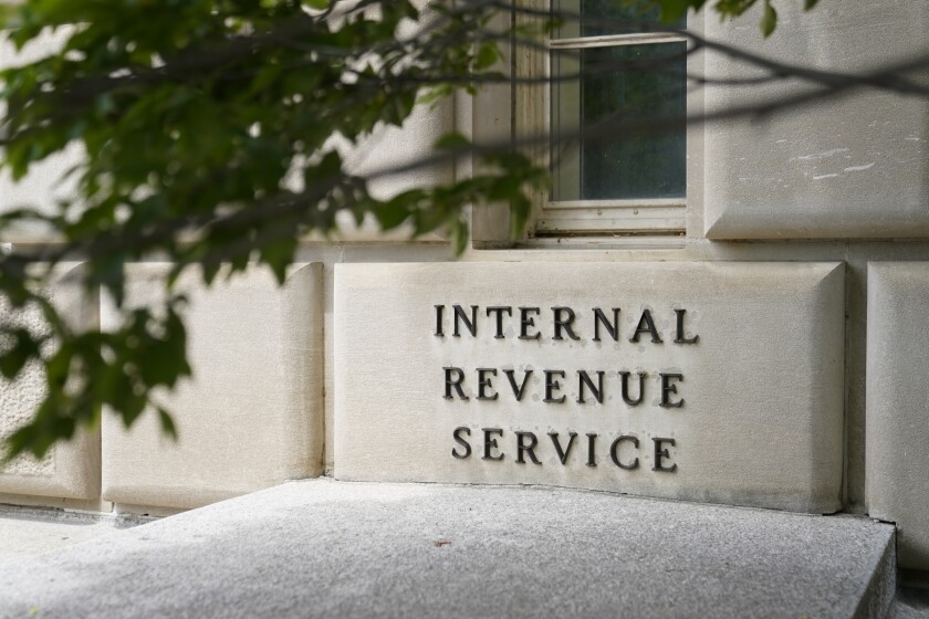 This May 4, 2021 photo shows a sign outside the Internal Revenue Service building in Washington. This year's tax filing season will begin on Jan. 24, 17 days earlier than last year, the Internal Revenue Service announced Monday, Jan. 10, 2022. (AP Photo/Patrick Semansky)