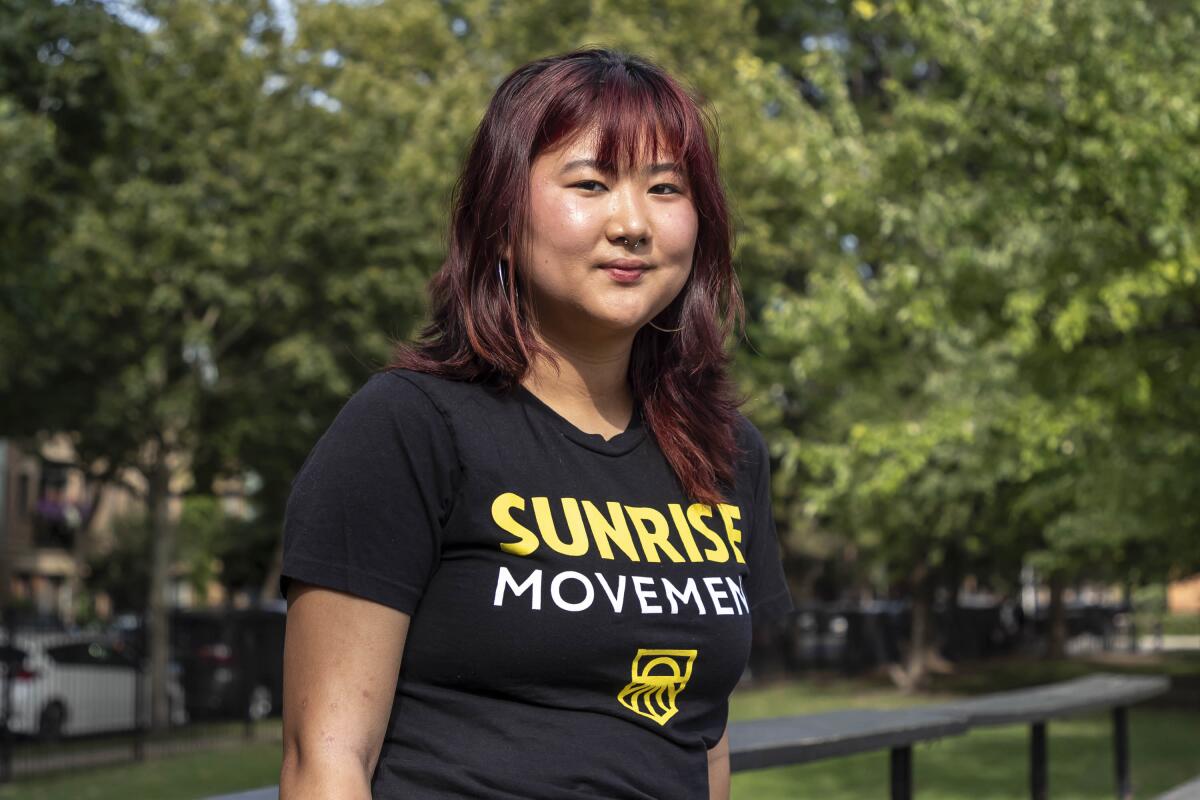 Wei Zhou wears a Sunrise Movement T-shirt.