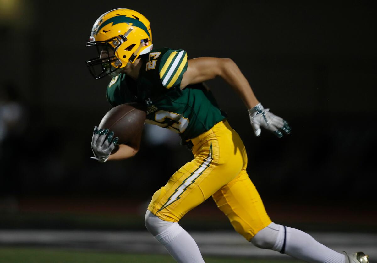 Edison's Nico Brown returns a punt against San Juan Hills in the first half of a nonleague game at Huntington Beach High on Sept. 13.