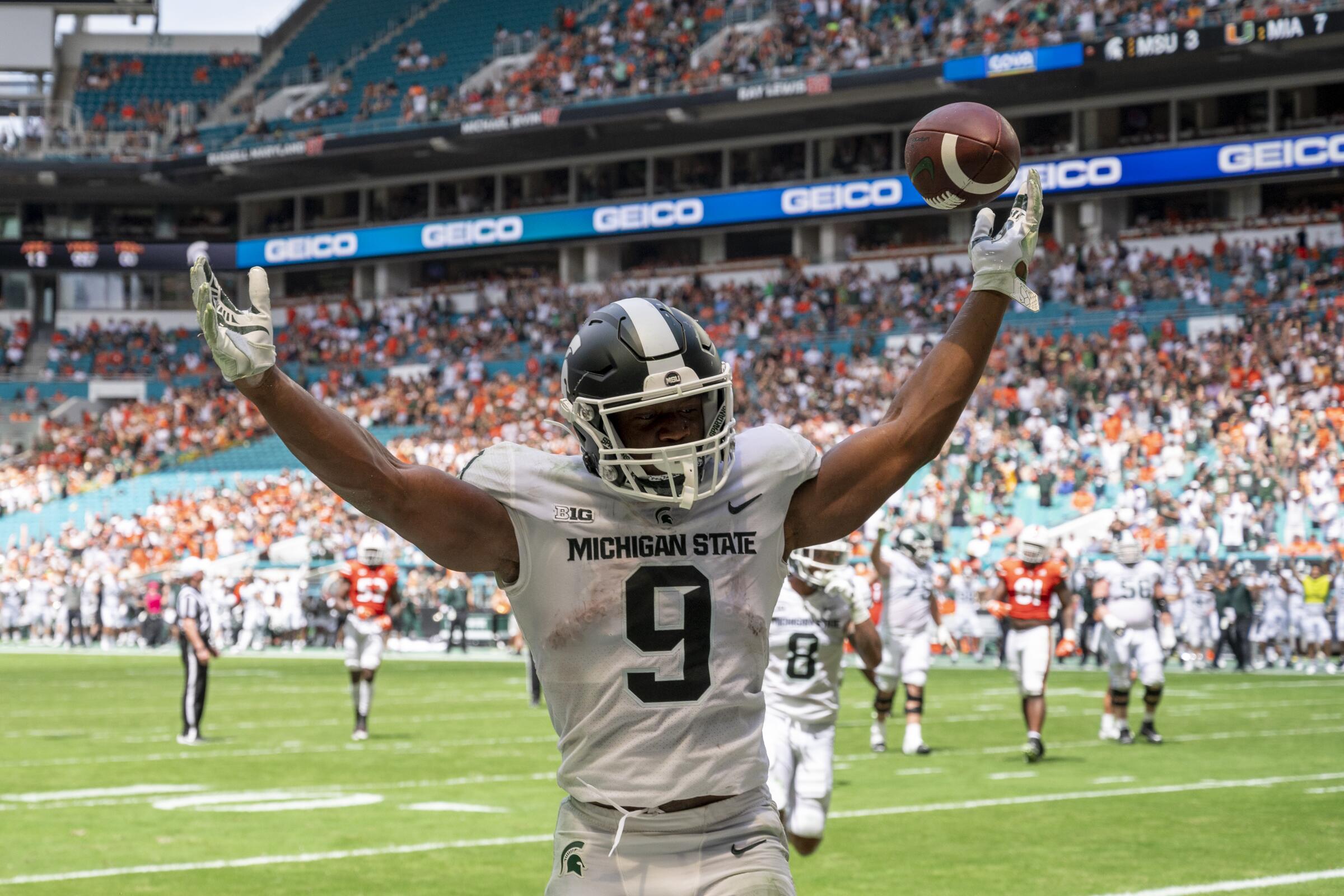 Michigan State running back Kenneth Walker III celebrates after scoring a touchdown against Miami on Sept 18.