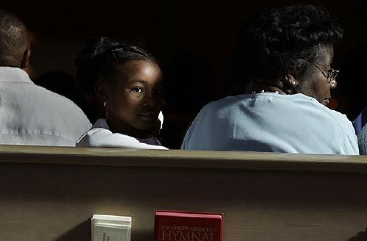 Sydney Addison and her grandmother Pearl Allison, right, attend services at Holman United Methodist Church in L.A. Shortly before his death 40 years ago, the Rev. Martin Luther King Jr. transfixed the church's congregation. More Photos
