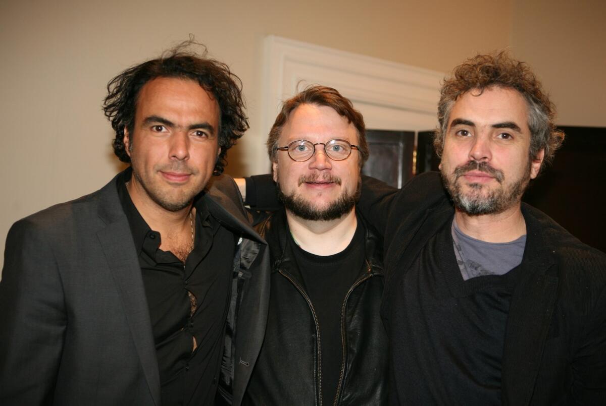Guillermo del Toro (centro), González Iñárritu (izq.) y Alfonso Cuarón (der.)