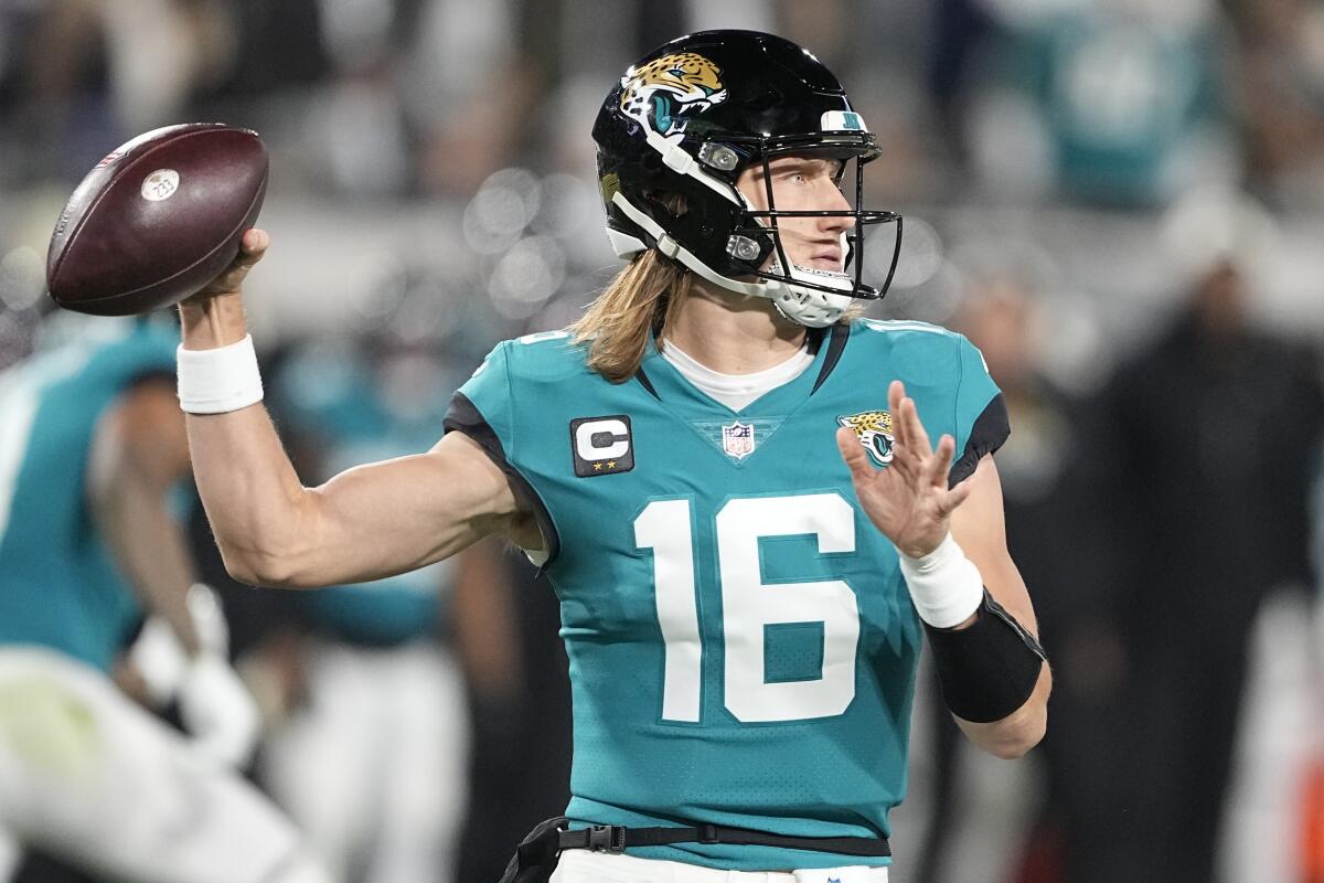 Jacksonville Jaguars quarterback Trevor Lawrence passes against the Chargers in the first half.