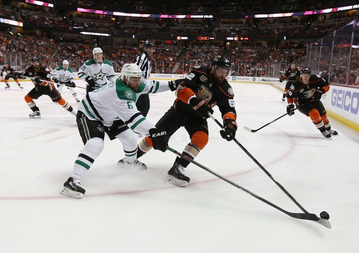 Patrick Maroon, right, battles Dallas' Trevor Daley during the Ducks' 6-2 victory in Game 5 of the teams' playoff series Friday at the Honda Center.