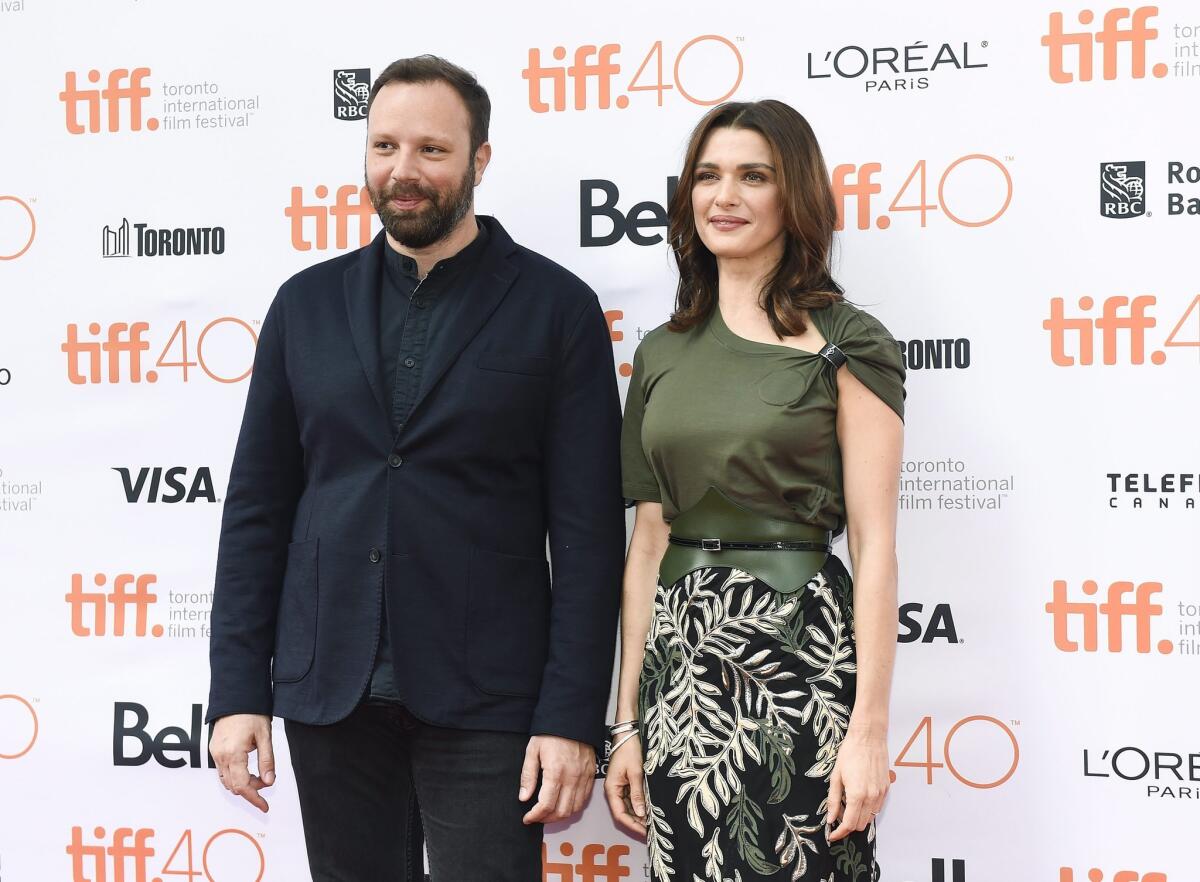 Director Yorgos Lanthimos, left, and actress Rachel Weisz stand on the red carpet for the movie "The Lobster " during the 2015 Toronto International Film Festival.