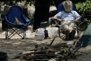 Orr, Francine –– – 100829.ME.0813.camping1.FO––Michael Clayton rests at the Millard Campground in the Angeles National Forest Saturday afternoon, August 13, 2005. Millard is one of the closet campgrounds anywhere to the city. It is located just 1 1/2 miles up a winding road from Altadena.