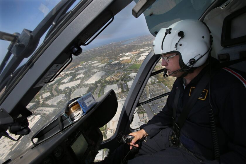 Mercy Air pilot Larry Lockey flies around coastal North County Thursday morning.