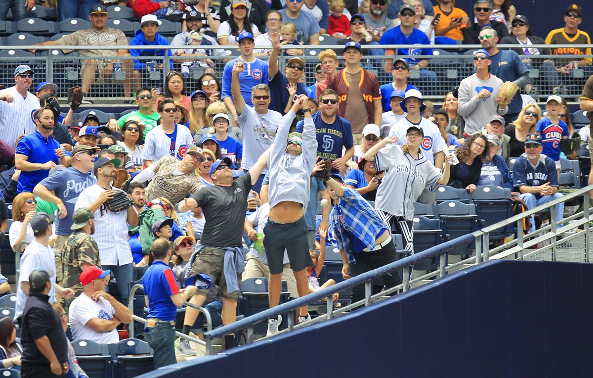 Fans try to catch a foul ball during a San Diego Padres against the Chicago Cubs at Petco Park on May 29, 2017. (K.C. Alfred/Union-Tribune)