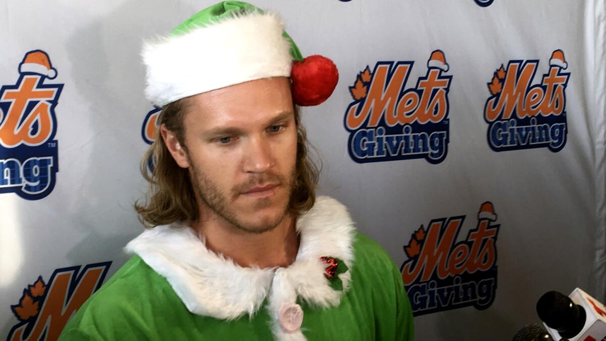 Mets baseball pitcher Noah Syndergaard speaks to reporters during the Mets' annual Kids Holiday Party at Citi Field in New York on Thursday.