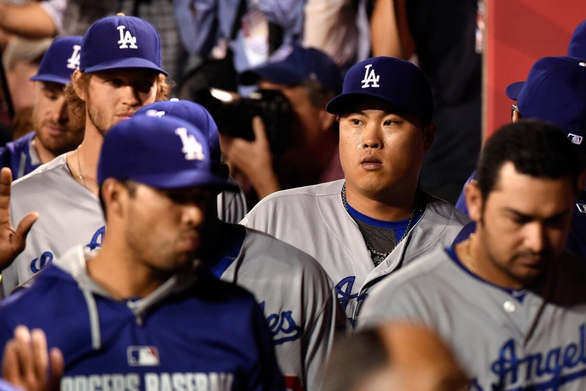 Dodgers pitcher Hyun Jin-Ryu returns to the dugout in the seventh inning of a game Thursday against the Angels. Ryu held the Angels to just two hits over seven innings in the Dodgers' 7-0 win.