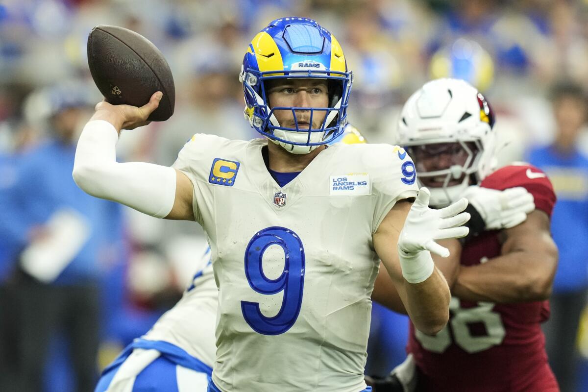 Rams quarterback Matthew Stafford looks to pass against the Cardinals on Sunday.