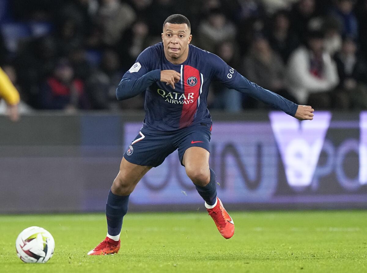 PSG's Kylian Mbappe controls the ball during a French League One soccer match against Metz 