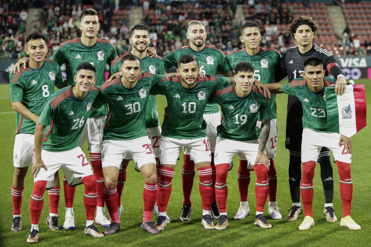 Mexico's starting players pose for 