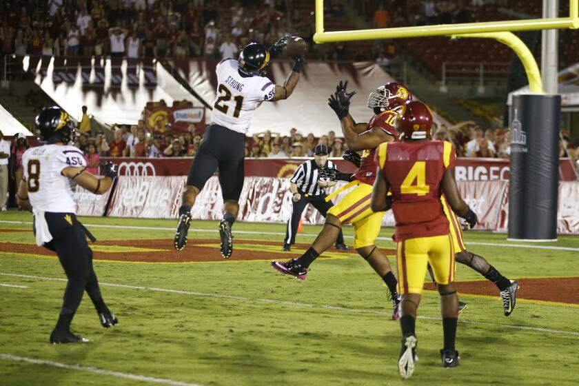 Arizona State's Jaelen Strong catches a Hail Mary pass in front of USC's Hayes Pullard (10) on the final play last Saturday at the Coliseum.