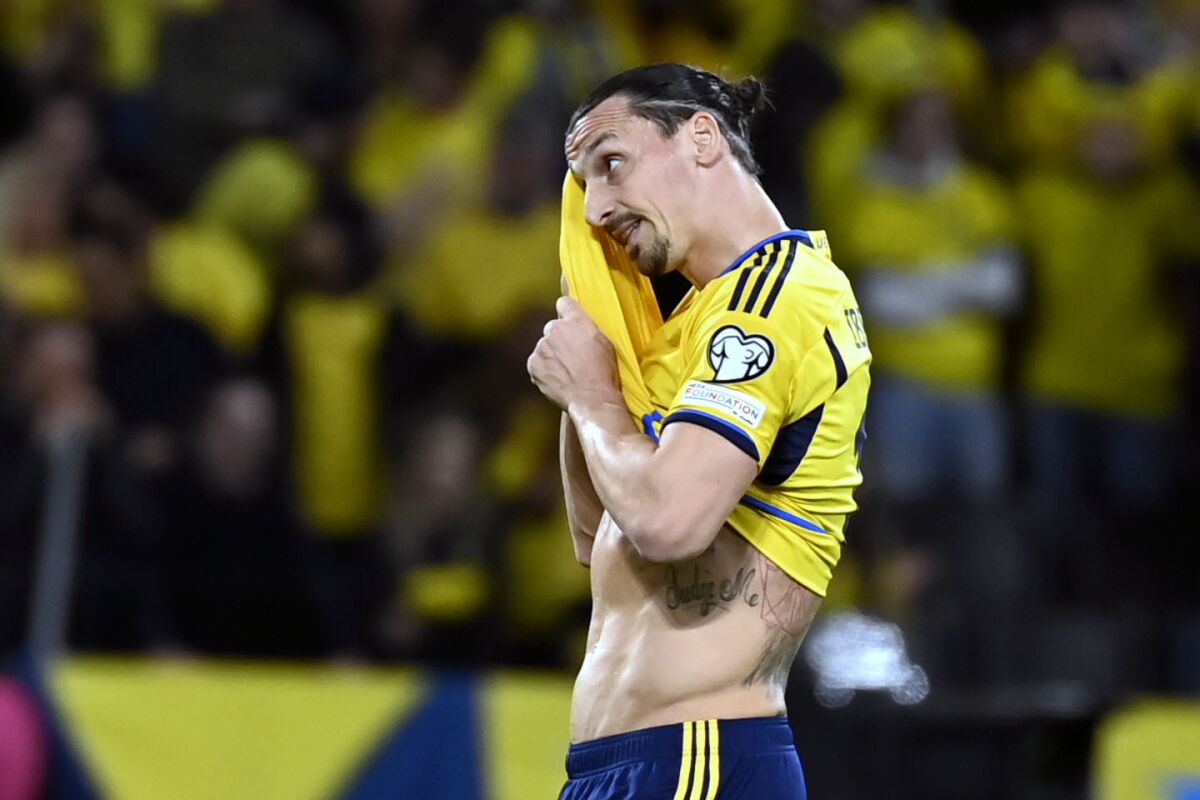 Sweden's Zlatan Ibrahimovic wipes his brow during the Euro 2024 group F qualifying soccer match between Sweden and Belgium at Friends Arena in Stockholm, Friday March 24, 2023. (Maja Suslin/TT News Agency via AP)