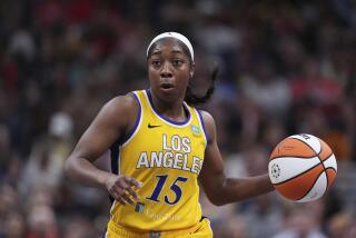 Los Angeles Sparks guard Aari McDonald (15) plays against the Indiana Fever.