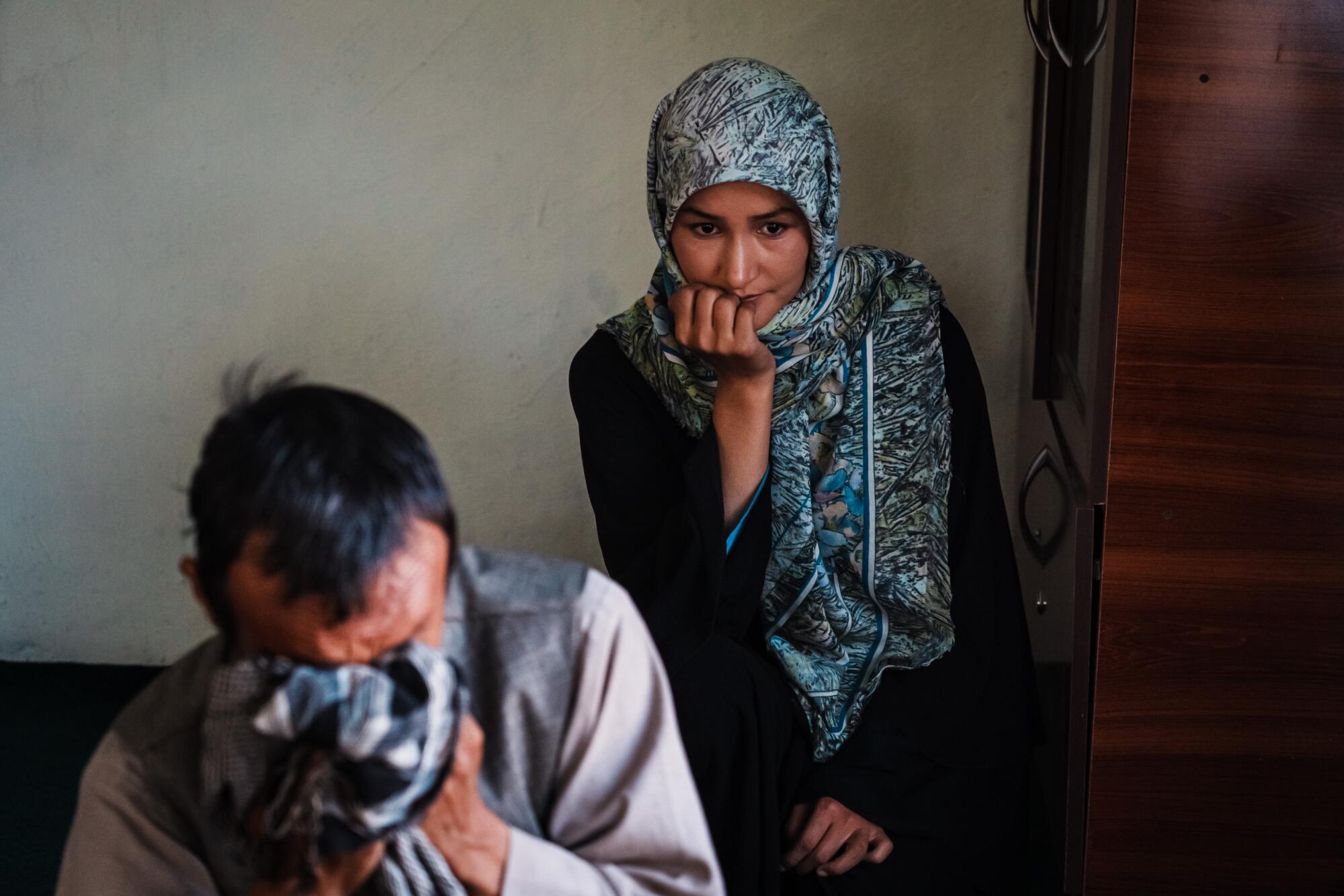 Meena Ibrahim and her father Mohammad Ibrahim Mohammadi, 46, tear up while talking.