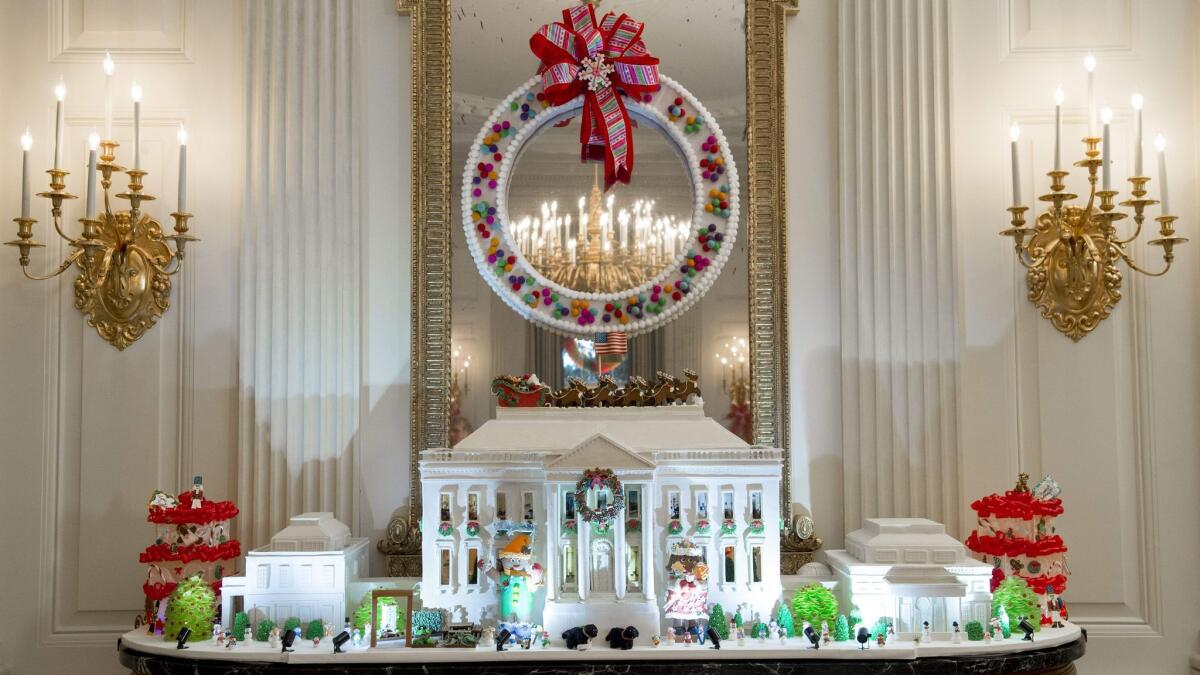 The White House gingerbread house is made of 150 pounds of gingerbread, 100 pounds of bread dough, 20 pounds of gum paste, 20 pounds of icing and 20 pounds of sculpted sugar pieces.