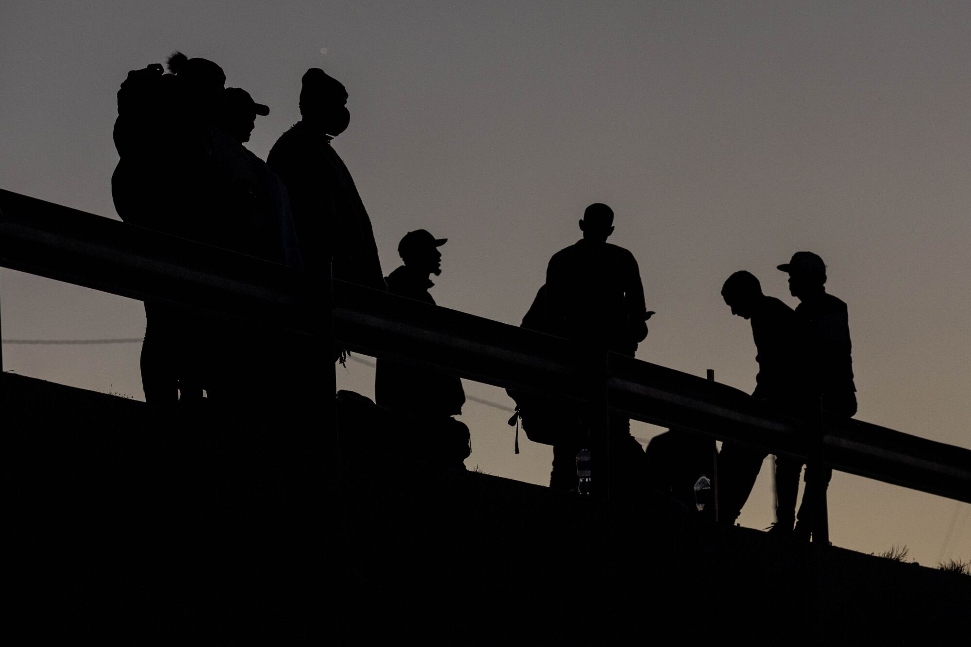 Silhouette of about 10 people 