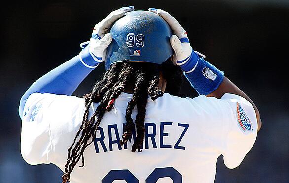 April 13, 2010: Manny Ramirez, the Dodgers' dreadlocked left fielder, adjusts his batting helmet in the sixth inning of the Dodgers' home opener against the Diamondbacks at Dodger Stadium.