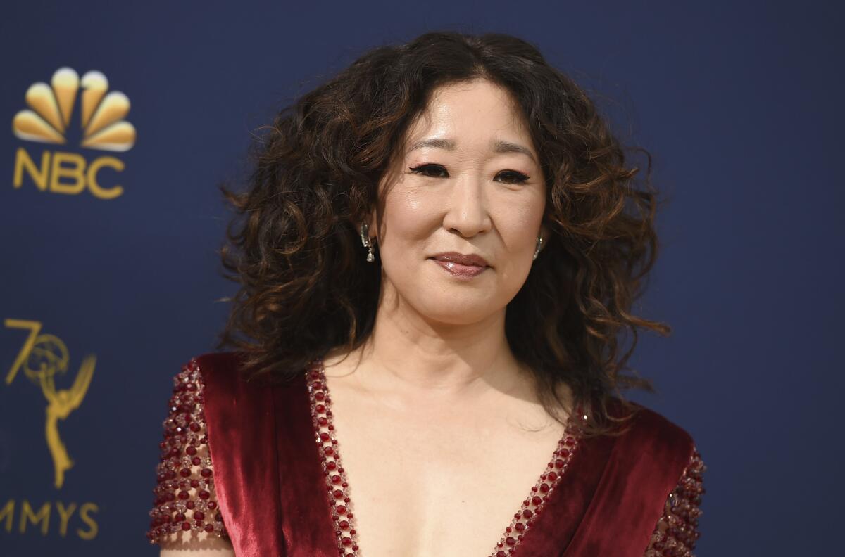 Lead actress in a drama nominee Sandra Oh has her Korean immigrant parents in tow on the red carpet and they met a very special actor.