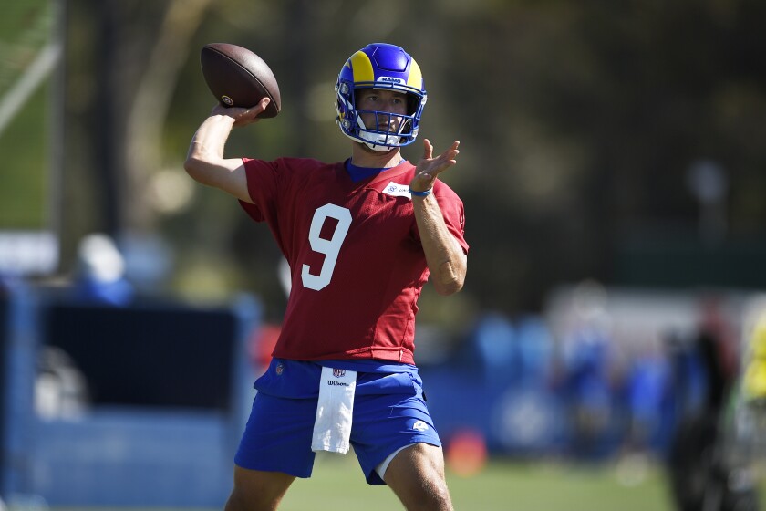 Los Angeles Rams quarterback Matthew Stafford throws a pass during NFL football training camp practice in Irvine, Calif., Saturday, July 31, 2021. (AP Photo/Kelvin Kuo)