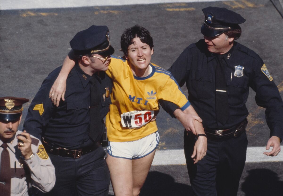 Rosie Ruiz is shown moments after crossing the finish line as the apparent women's race winner of the 84th Boston Marathon on April 21, 1980. 