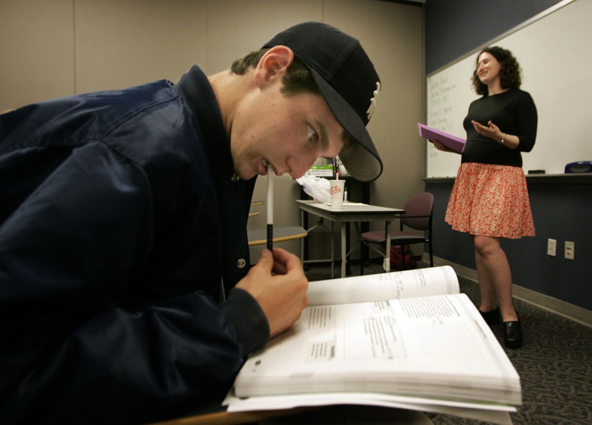Adam Greene participates in an SAT preparation class taught by Justine Borer, right, in Westwood in 2006.