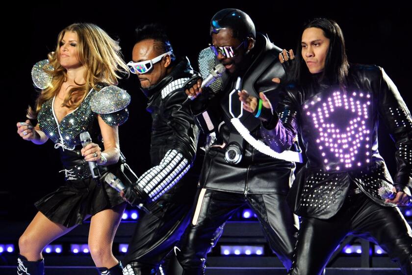 Fergie, apl.de.ap, will.i.am and Taboo of The Black Eyed Peas perform during the Bridgestone Super Bowl XLV Halftime Show at Dallas Cowboys Stadium on February 6, 2011 in Arlington, Texas.